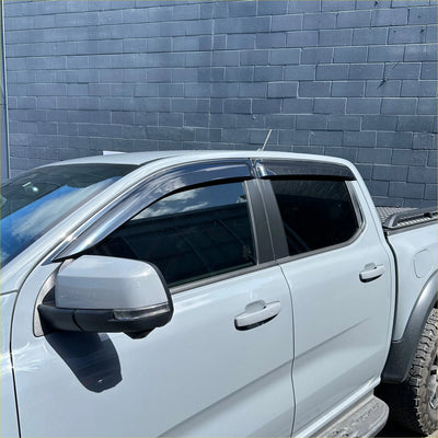 Clear transparent plastic window visors installed on white ford ranger 2022+ for weather shield door protection