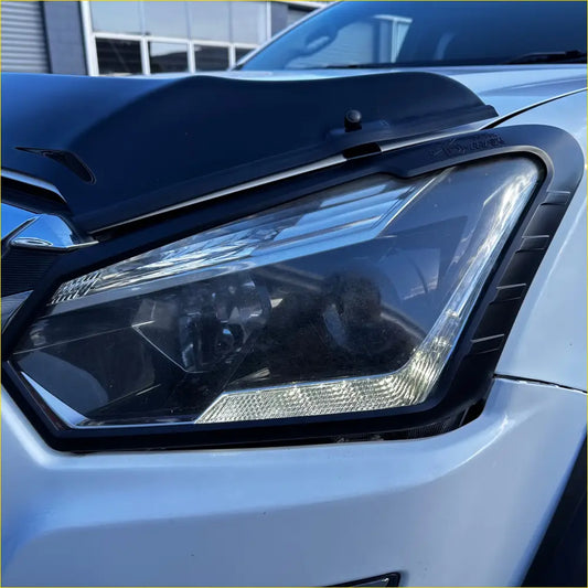 Black plastic 4x4 hood deflector with integrated mounting bracket and textured edge trim for night driving lights