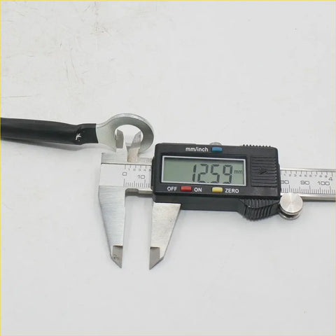 Black-handled wrench with silver metallic head measuring 12.59 mm for 18 inch tailgate cables nissan titan