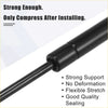 Black gas spring with sleek cylindrical design and smooth finish for toyota 80 series front bonnet gas struts 1990 1997