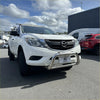 White mazda bt-50 pickup with medium size 304 stainless steel chrome nudge bar and roof rack visible from front