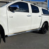 Chrome finished 4 inch oval stainless steel running board mounted along the lower edge of white d max double cab door