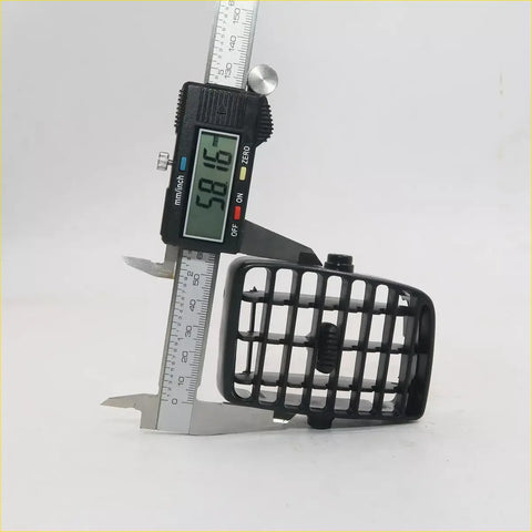 Black plastic air vent grille for toyota hilux 6th gen measured with digital caliper showing back side