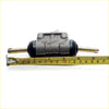 Gray metallic 7/8 rear wheel brake cylinder for Toyota Hilux with black rubber seals and brass rods back side view