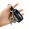 Black car key fob with silver metal 10th anniversary charm on black leather strap featured in 70th anniversary key ring