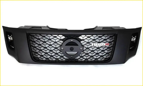 Black aftermarket grill for nissan navara nismo with honeycomb mesh pattern and fusion badge on the front side
