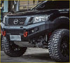 Black nissan np300 pickup with rugged aftermarket grill navara nismo and off-road tires in black finish