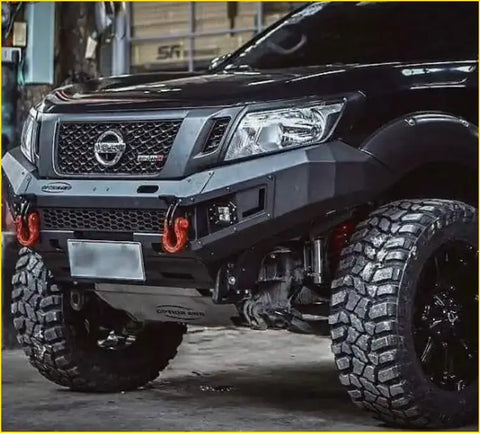 Black nissan np300 pickup with rugged aftermarket grill navara nismo and off-road tires in black finish