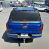 Blue ford ranger xlt with black aluminium canopy carport cover and roof rack shown from the back side
