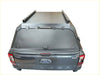 Black matte aluminum hardtop canopy with led light bar and side rails mounted on ford ranger xlt back side view