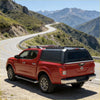 Back view of red nissan frontier with black aluminium canopy with rear view glass and roof rack for nissan navara 2015-2025