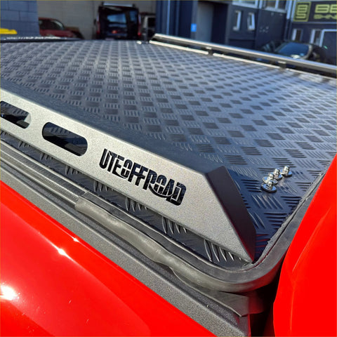 Black diamond plate aluminum hard lid truck bed cover with ute offroad silver trim for ford ranger 2022 back side view