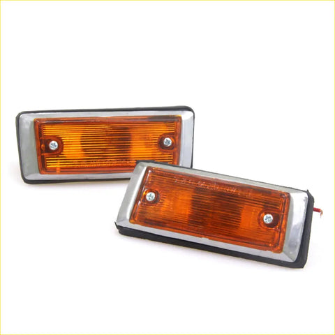 Rectangular amber side marker lights with chrome metal frames and black rubber edges for toyota hilux 72-78