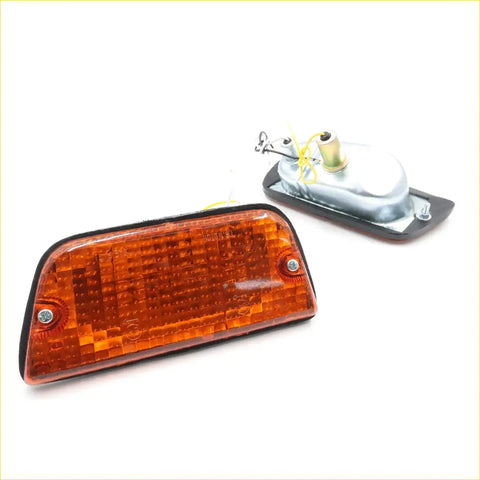 Orange rectangular marker light with textured lens and black plastic housing for nissan datsun 620 amber turn signals