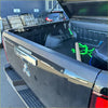 Backside view of black mitsubishi pickup with textured black bedside rail covers 3 piece set for triton 2024+