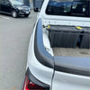Black textured rubber bedside rail covers for white nissan navara 2021 pickup truck side protector shown from back