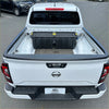 White nissan navara 2021 pickup truck back showing textured black bedside rail covers 3 piece set with black storage box