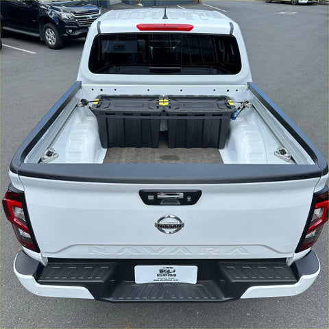 White nissan navara 2021 pickup truck back showing textured black bedside rail covers 3 piece set with black storage box