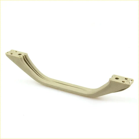 Beige plastic roof rail handle with molded mounting brackets for nissan ute navara 1995-1999 shown from back side