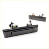 Black plastic door handle with spring mechanism and mounting hardware for Toyota Hilux ute 1984-1988 back side view