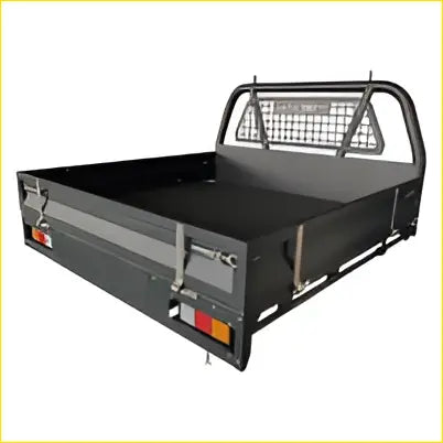 Back view of black powder coated heavy duty steel flat tray with mesh rear gate and side rails for dual cab ute