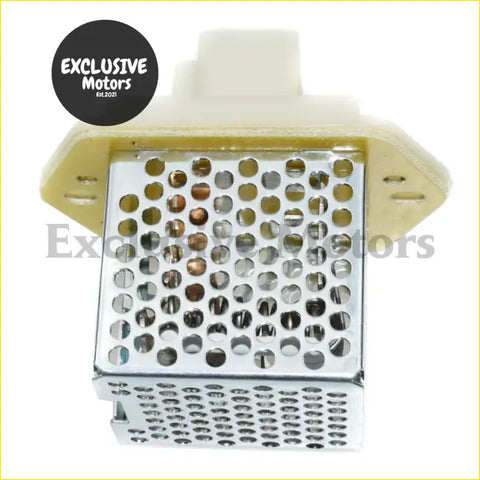 White plastic blower motor resistor housing with perforated metal grid and copper contacts for nissan pathfinder d21 back side