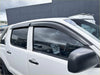 Black plastic window visors installed on a white toyota hilux 2005-2012 with bonnet guard matte black monsoon