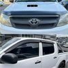 White toyota hilux pickup with matte black bonnet guard and black grille and window visors from monsoon for 2005-2012