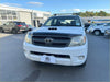 White toyota hilux pickup with matte black bonnet guard and black front grille roof rack for monsoon 2005-2012