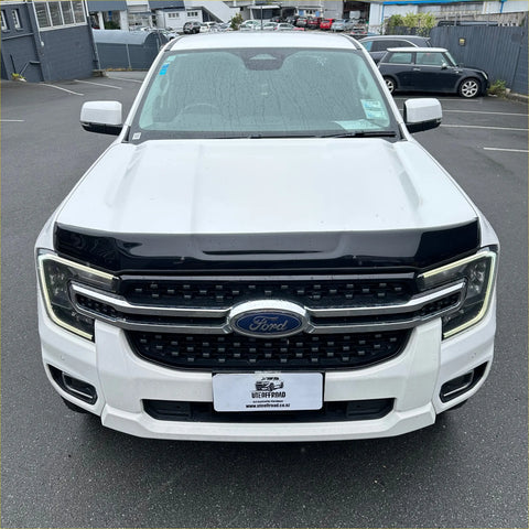 White ford ranger with black grille and chrome accents featuring bonnet guard protector stone guard for ford everest 2022+