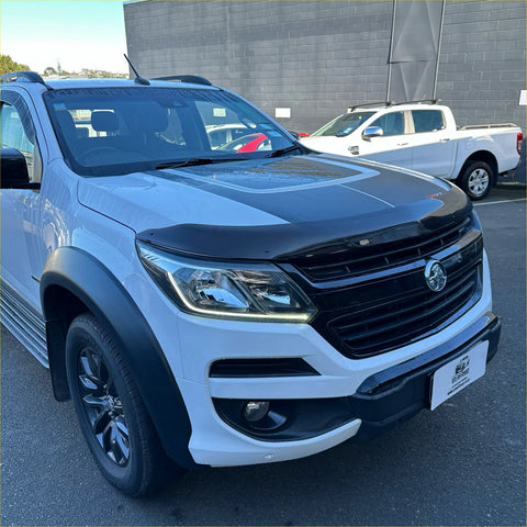 White and black holden colorado pickup with glossy finish featuring a bonnet guard protector stone guard