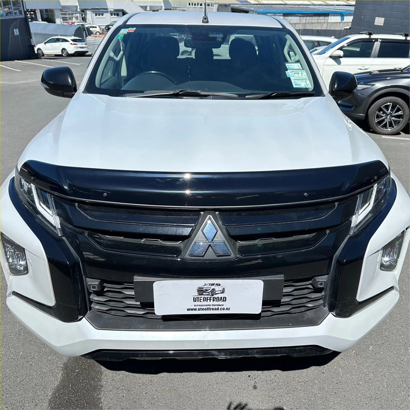 White mitsubishi triton pickup with black grille and bumper featuring bonnet guard protector stone guard 2019-2023