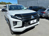 White mitsubishi triton with black accents and bold grille featuring bonnet guard protector stone guard 2019-2023