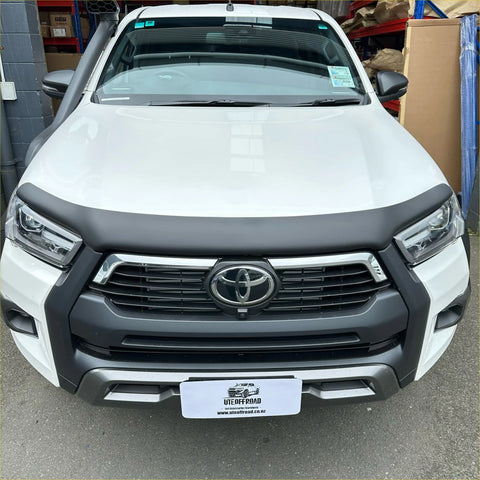 White toyota hilux 2021 plus with matte black bonnet guard protector and black front bumper guard with chrome accents
