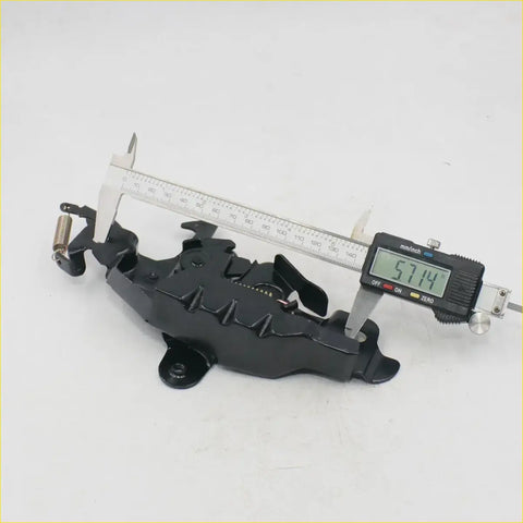 Black metal bonnet latch striker for toyota hilux 1988-1997 showing intricate spring and mechanical design back side