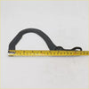 Black rubber-handled hacksaw with metallic blade resting on yellow tape for bonnet lock hinge lh toyota hilux 1988-1997