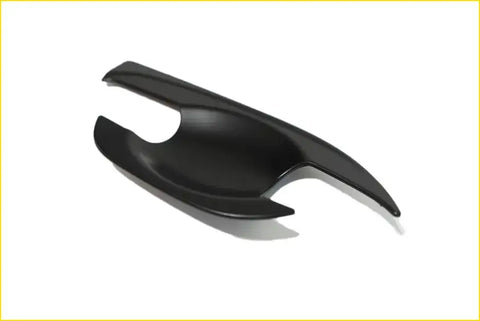 Black glossy plastic bowl inserts for navara with sleek curved car door handle cover design