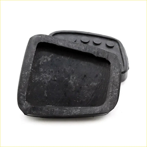 Black rubber brake clutch pedal pad with rounded edges and four circular indentations for mazda familia coupe