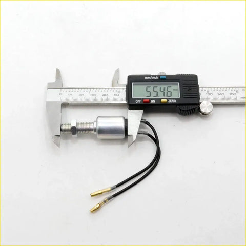 Silver cylindrical brake lightswitch motor with threaded shaft and black wires for nissan datsun caravan measured by caliper