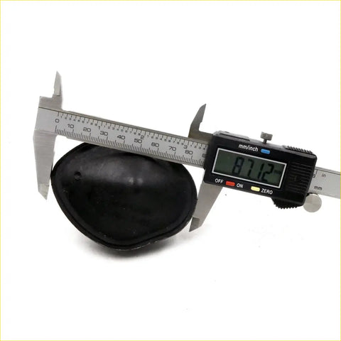 Black rubber eye patch with smooth rounded surface and raised edges for bumper set on nissan navara d23 np300 2014-2020
