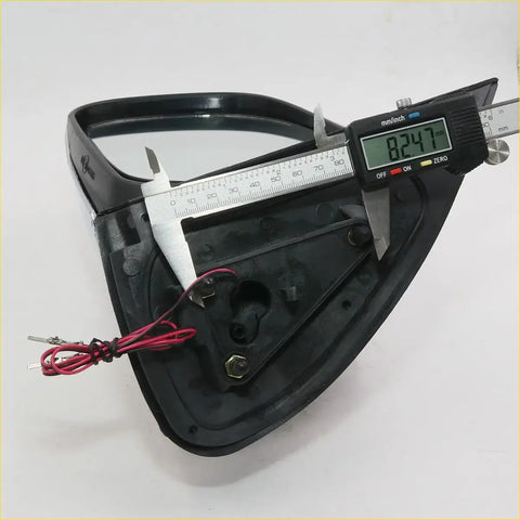 Black plastic motorcycle headlight assembly with wiring and mounts shown from the back for toyota hilux sr5 mirrors