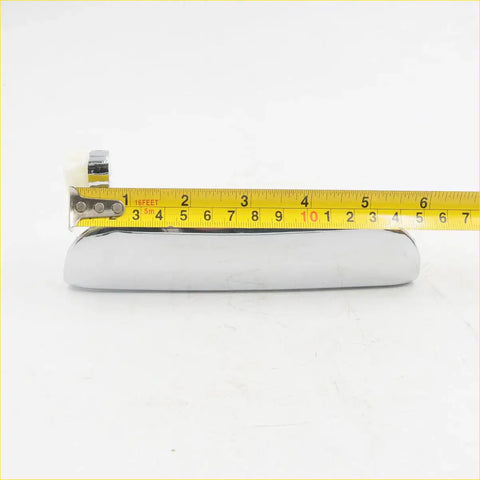 Chrome outer door handle right side for mazda b-series with sleek elongated oval shape and polished metallic surface