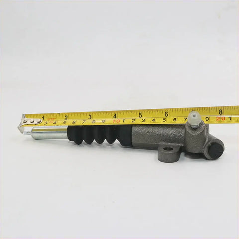 Gray metallic clutch slave cylinder with black rubber boot and silver piston rod for mazda b series b1600-b2600 e2000