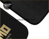 Black textured custom nis car floor mat with gold mid sports logo perfect for sporty rides