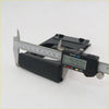 Black plastic dash cup holder track left base for toyota hilux kun15 being measured with digital caliper