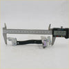 Black and silver metal door check stop strap latch mechanism for Toyota Hilux 2004-2015 shown from back side