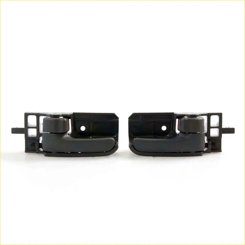 Black plastic door handle bezel with integrated hinges and brackets for toyota hilux sr5 shown from the back side