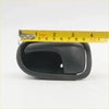 Black plastic door handle bezel right with smooth curved design and pull mechanism for mazda bravo b2000 ranger