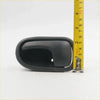 Black plastic door handle bezel right with smooth matte finish and integrated pull tab for Mazda Bravo and Ranger