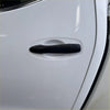 Matte black door handle cover on white nissan navara np300 2015-2020 with smart key system visible